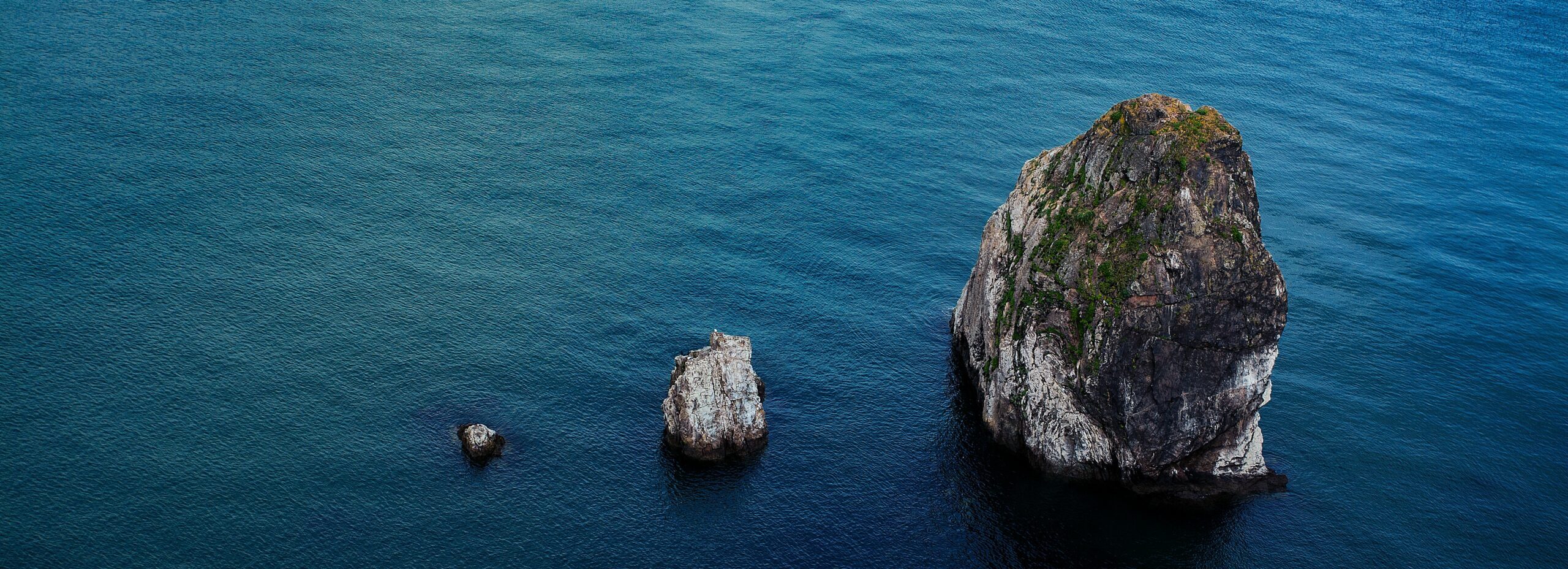 Three rock outcroppings look like stepping stones of increasing size. Is the assignment to create more or to scale these?